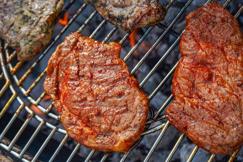 Menu 4 Traditional Open Charcoal Braai &mdash; steaks and boerewors over the coals