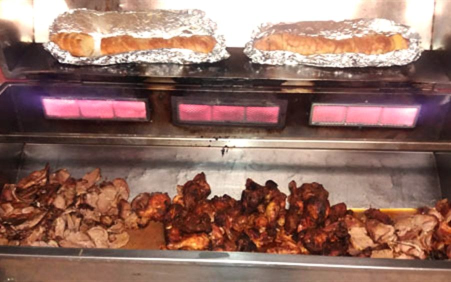 Menu 2 Sosatie Spit &mdash; lamb, beef and chicken sosaties with garlic breads warming above
